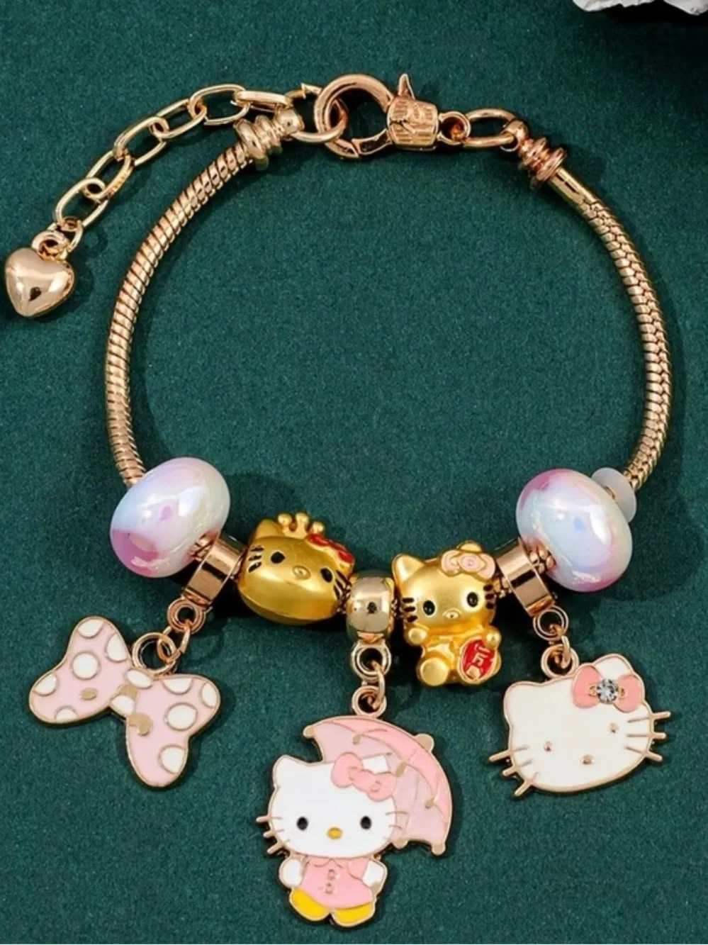 Hello Kitty Gold-Tone Pink Charm Bracelet for Kids.